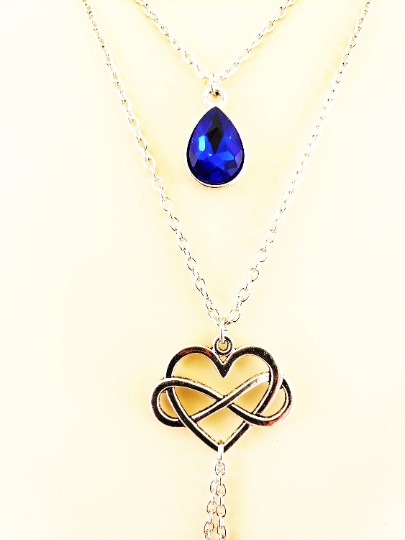 Poly Necklace with attached nipple nooses or feel the sting with nipple clamps. Poly amorous, Infinity Heart Multi Level Necklace