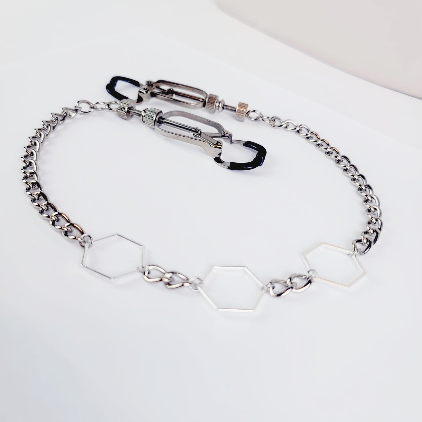 BDSM Nipple Clamps. Beetle Clamps with Hexagons and Chain.