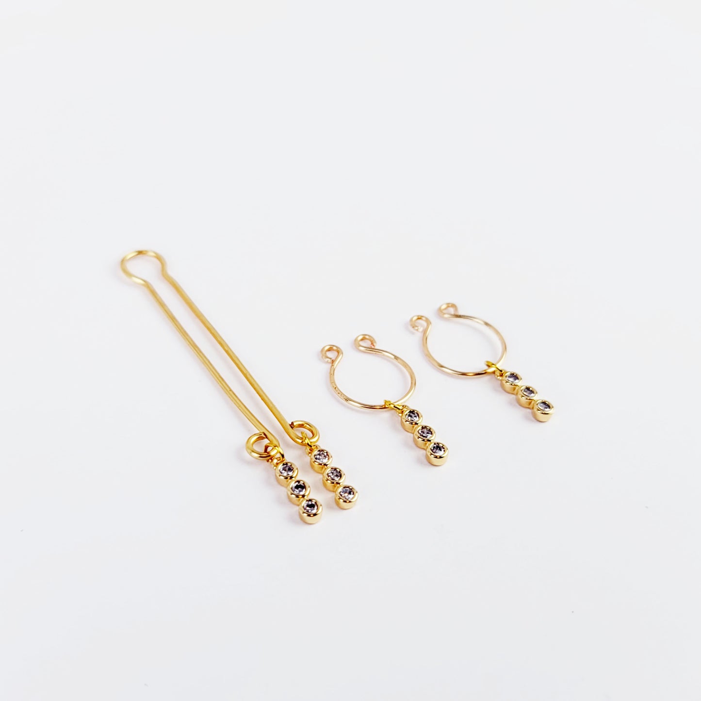 Gold Labia Clip and Horseshoe Style Nipple Rings with 18k Gold Tri Circle Gems.