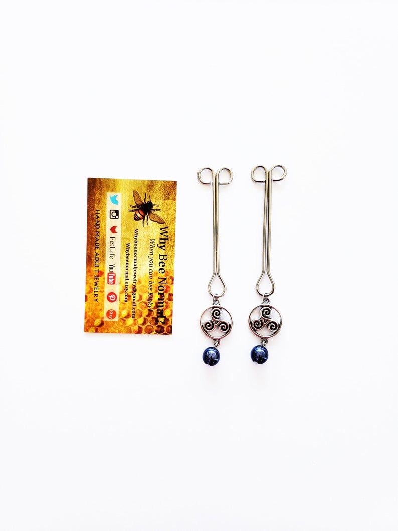 Straight Nipple Clamps with Triskelion and Purple Glass Beads