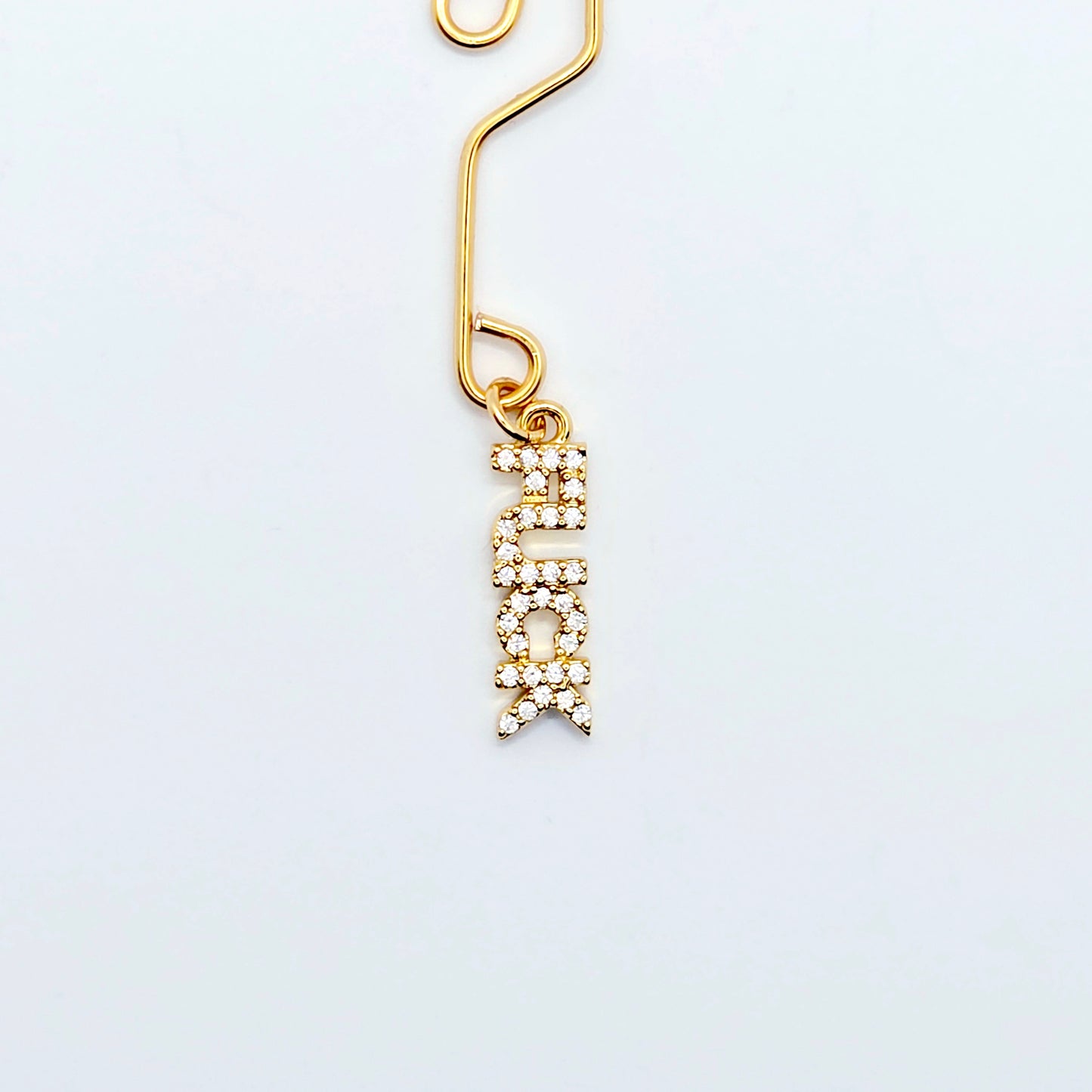 Naughty Gold Labia Clip with CZ Pendant - FUCK