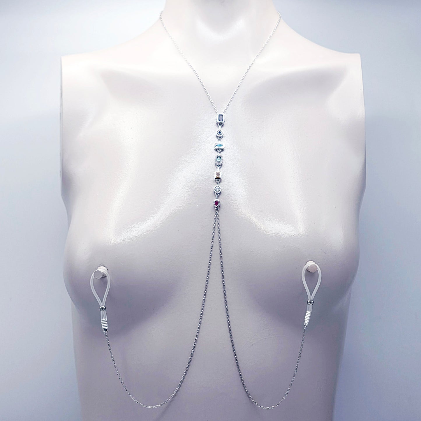 Platinum Necklace with Nipple Chains and Gemstones, with Nipple Nooses, on a mannequin against a white background.