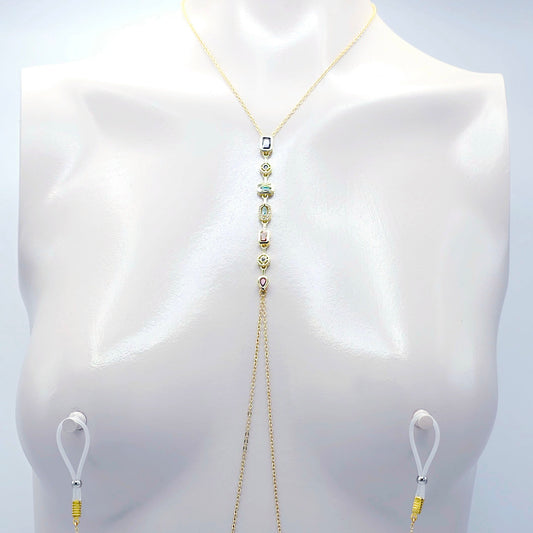 Gold body chain on a mannequin against a white background