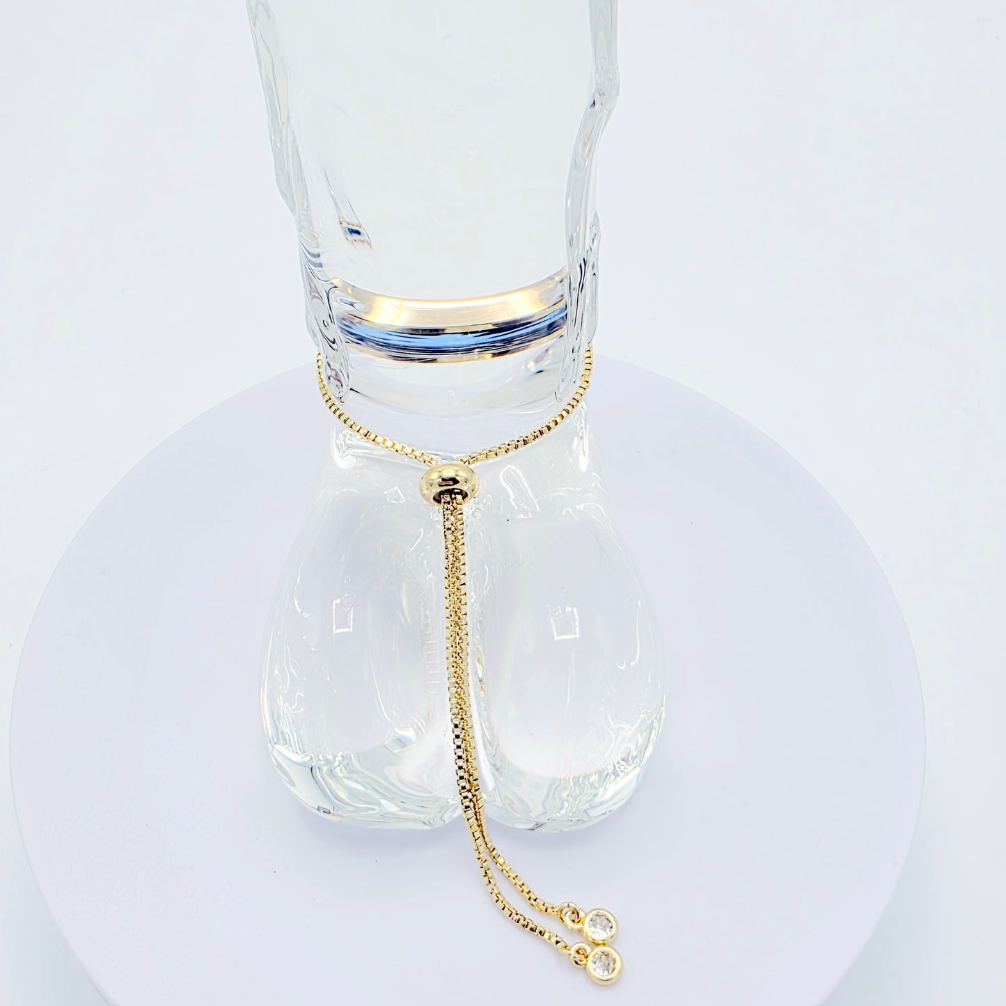 18k Gold Penis Noose Bracelet with Bright Blue Gem.