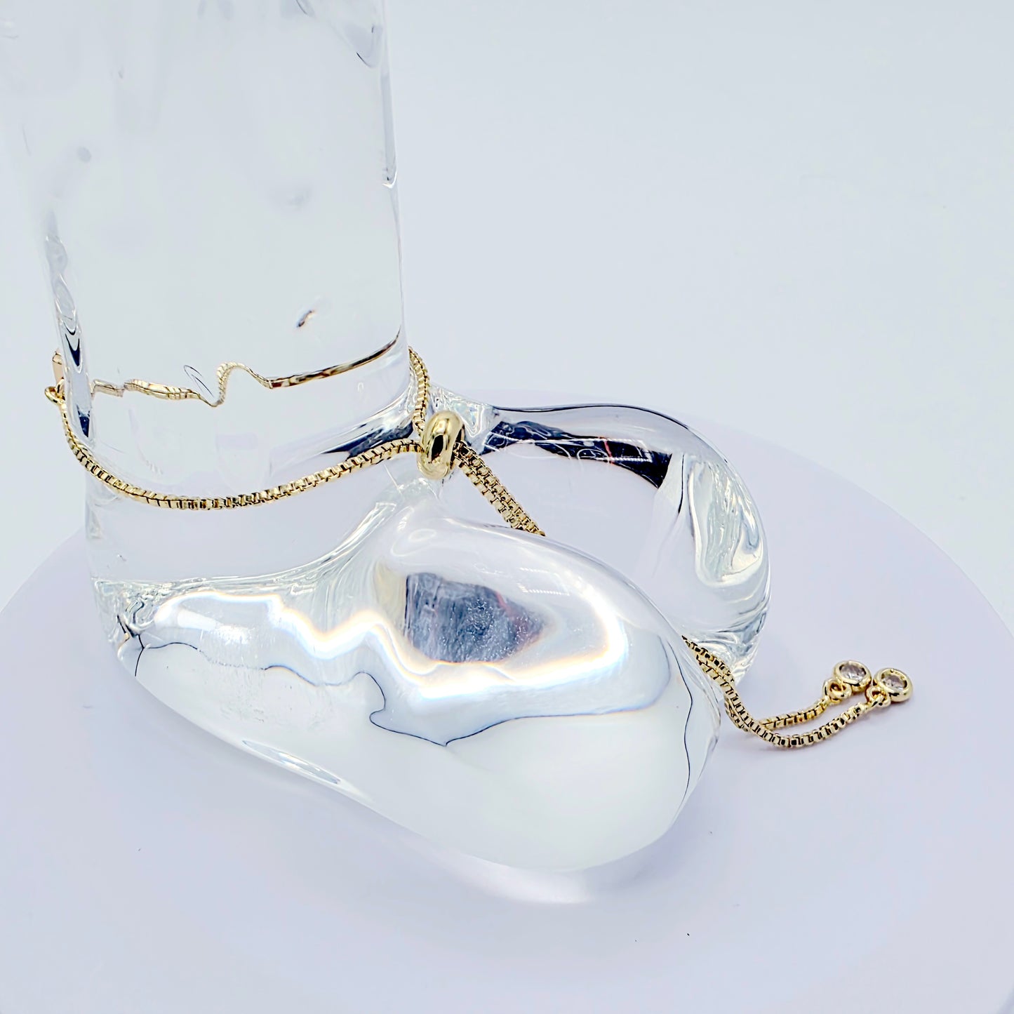 18k Gold Penis Noose Bracelet with Bright Blue Gem.
