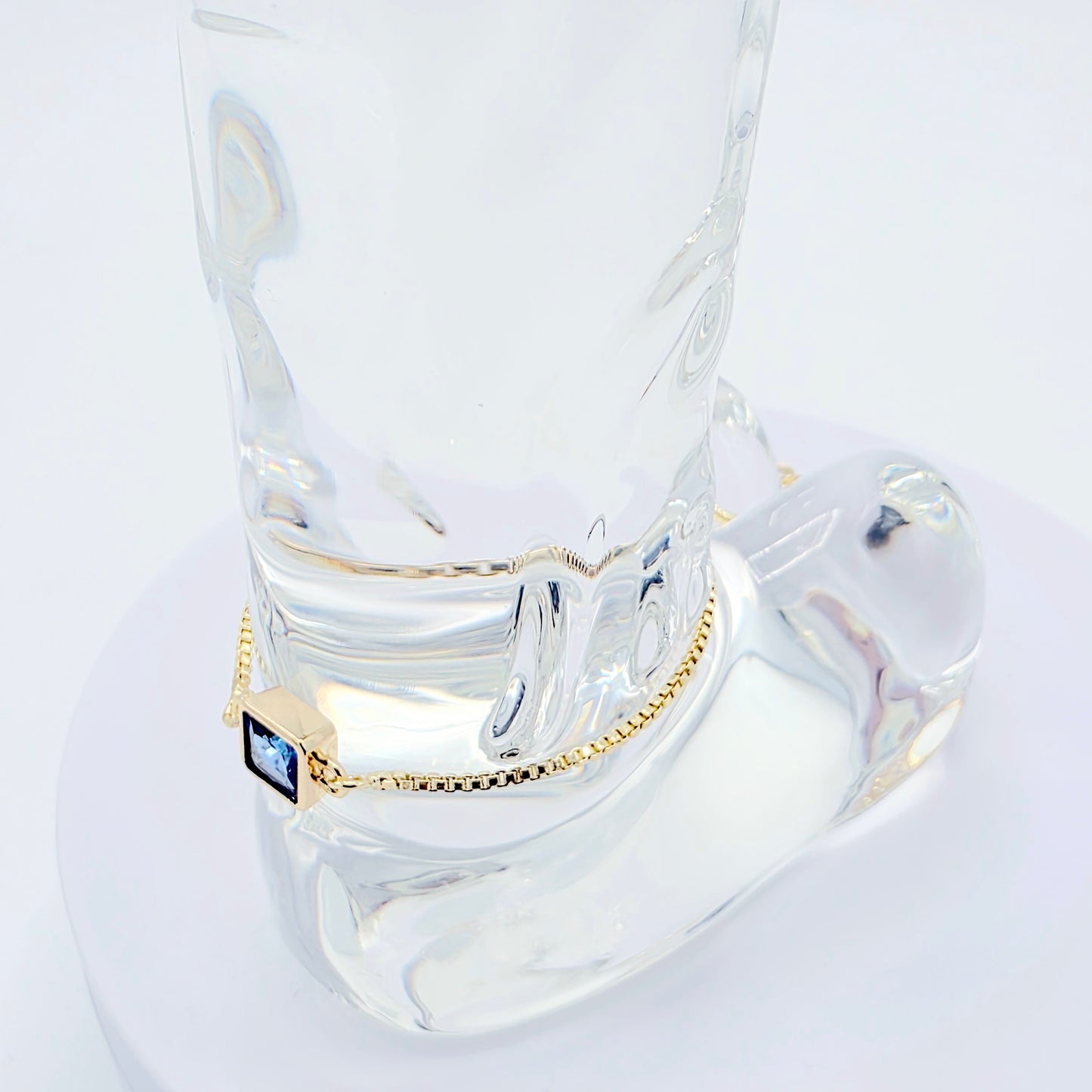 18k Gold Penis Noose Bracelet with Bright Blue Gem.