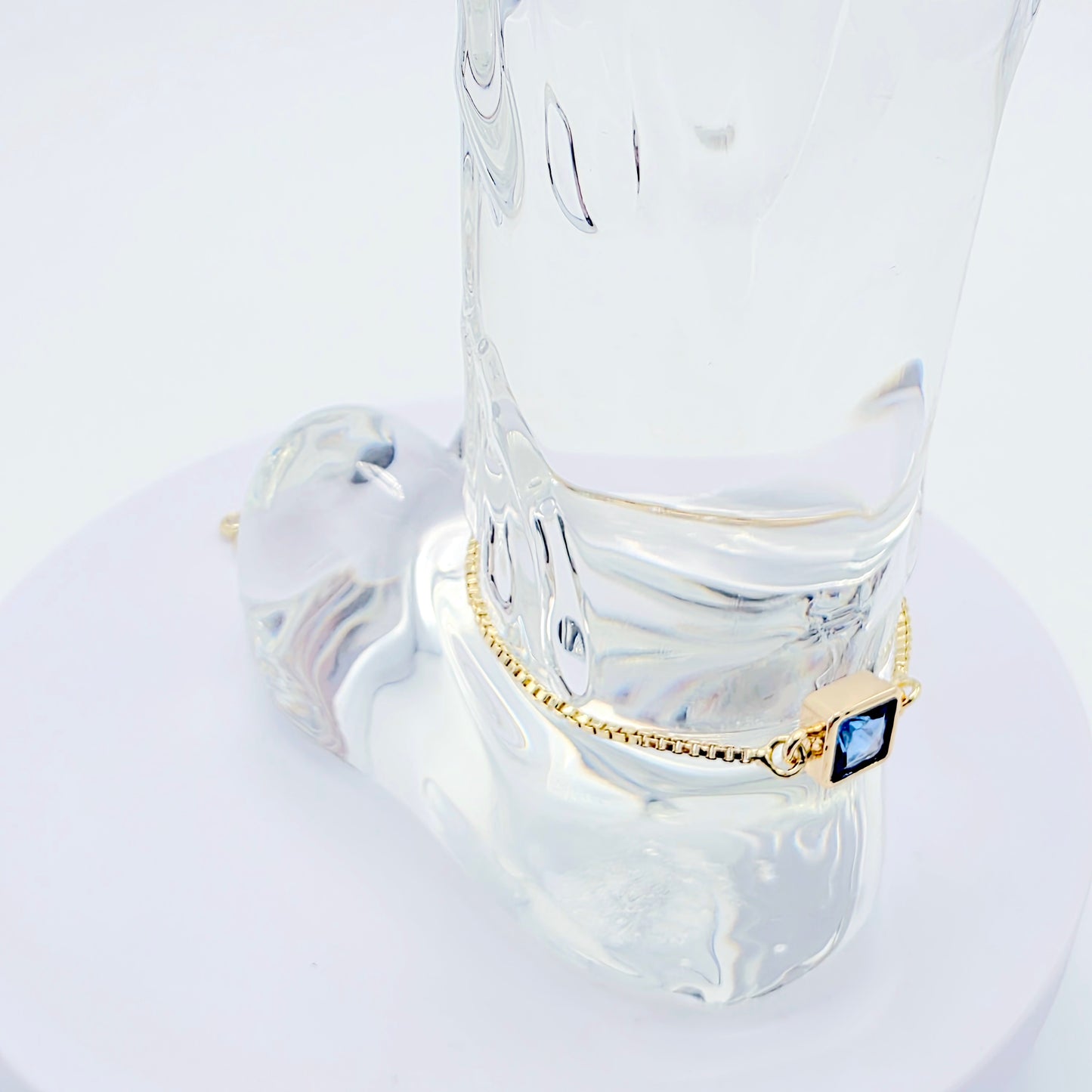 18k Gold Penis Noose Bracelet with Bright Blue Gem.