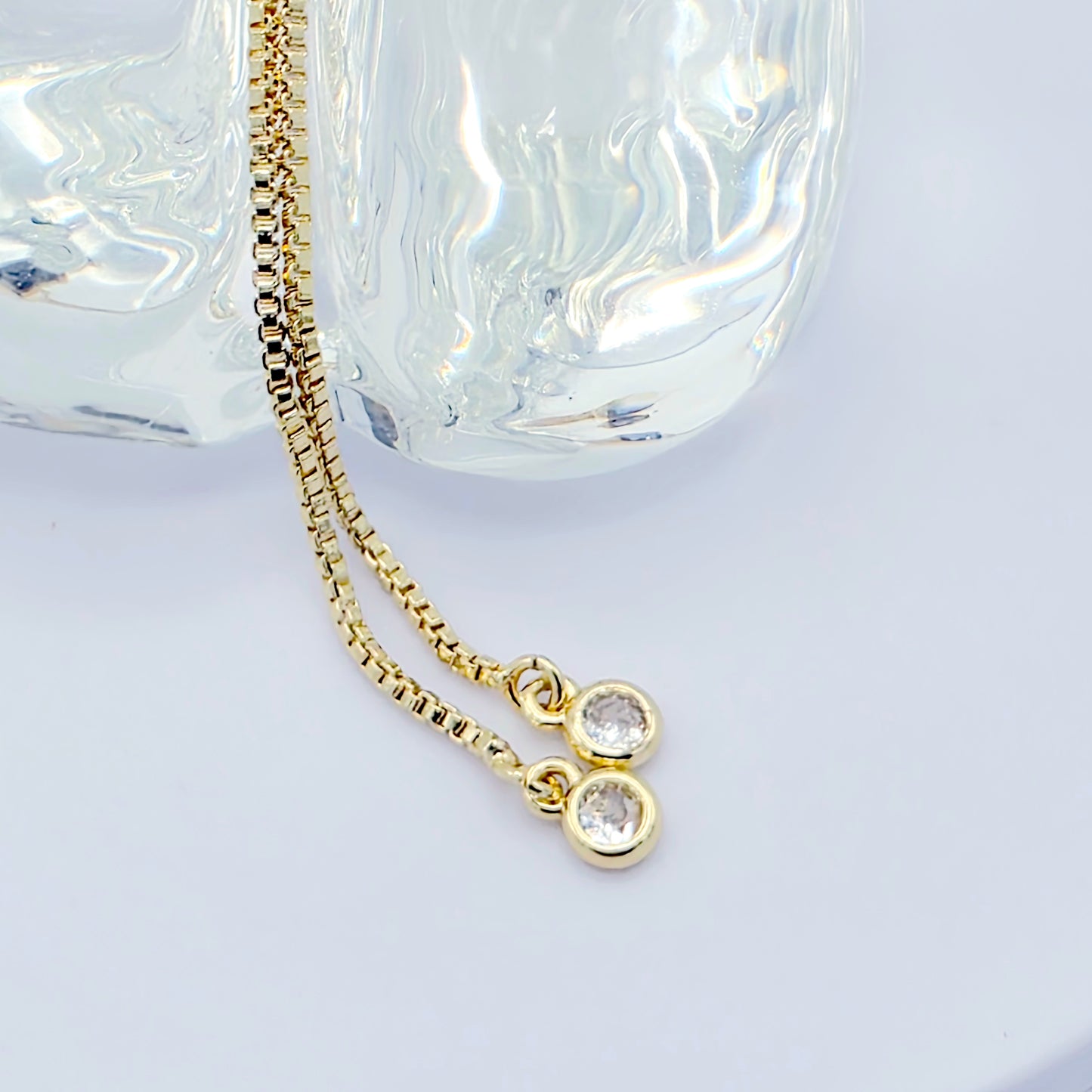 18k Gold Penis Noose Bracelet with Bright Blue Gem.