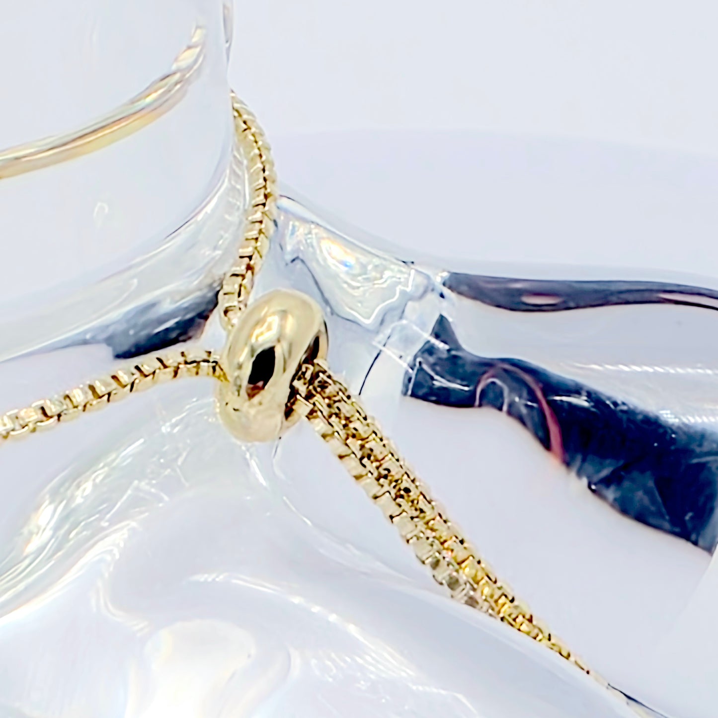 18k Gold Penis Noose Bracelet with Bright Blue Gem.