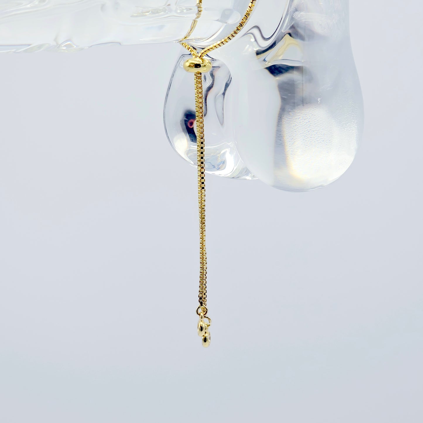 18k Gold Penis Noose Bracelet with Bright Blue Gem.