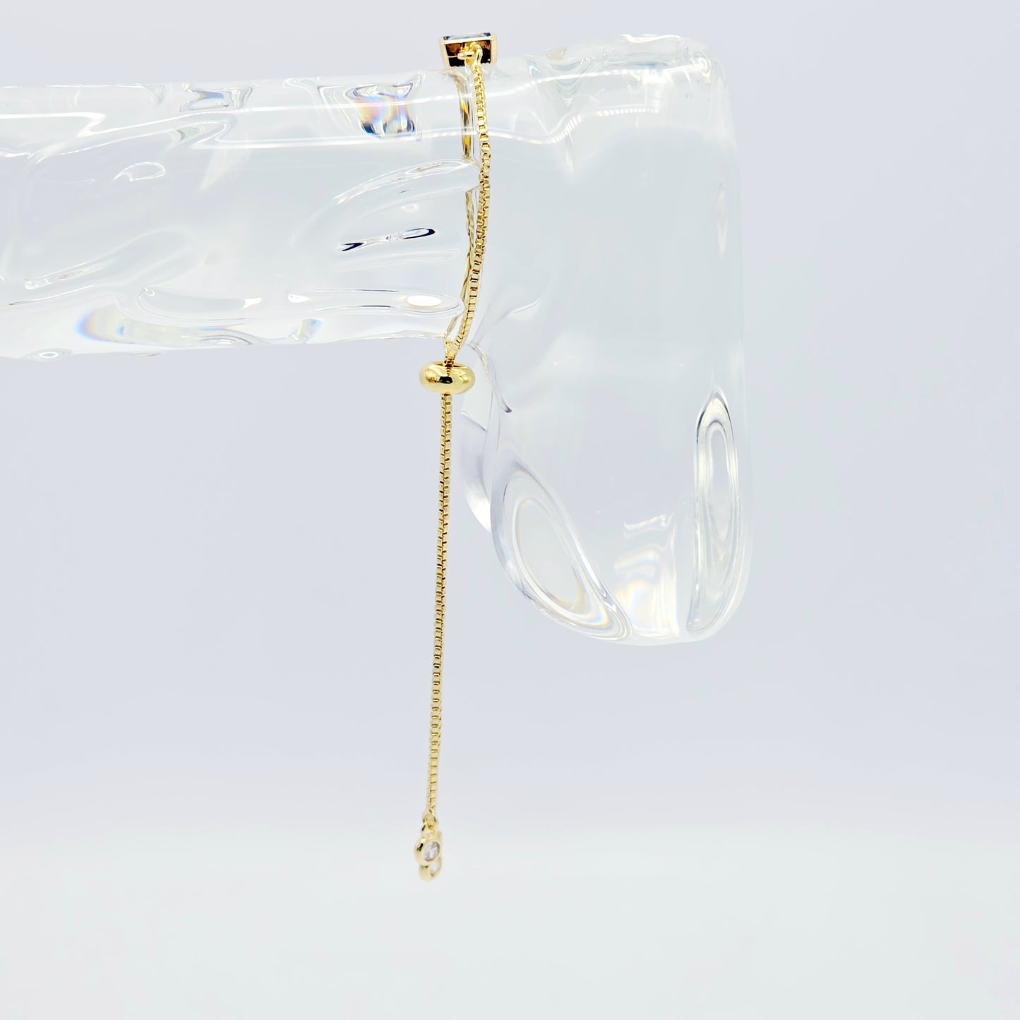 18k Gold Penis Noose Bracelet with Bright Blue Gem.