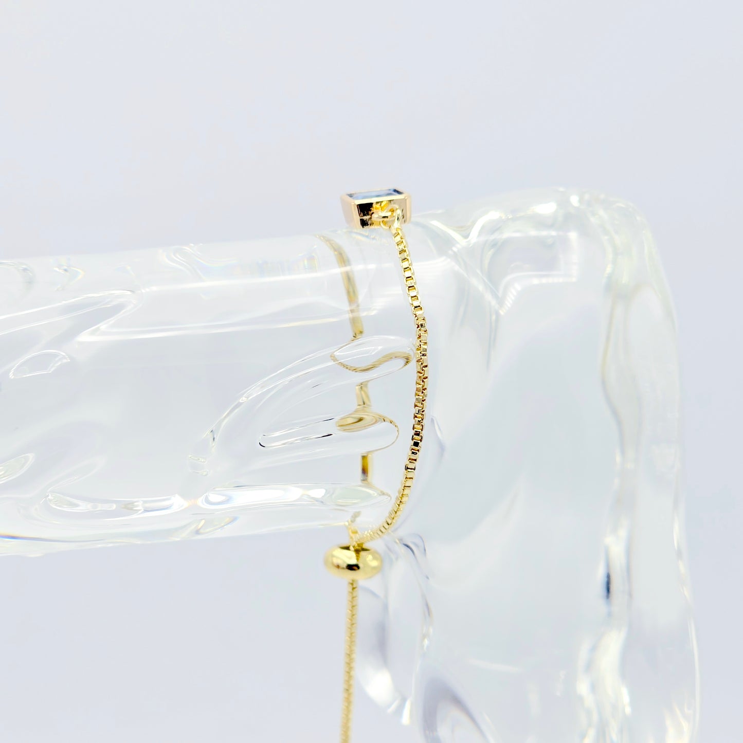 18k Gold Penis Noose Bracelet with Bright Blue Gem.