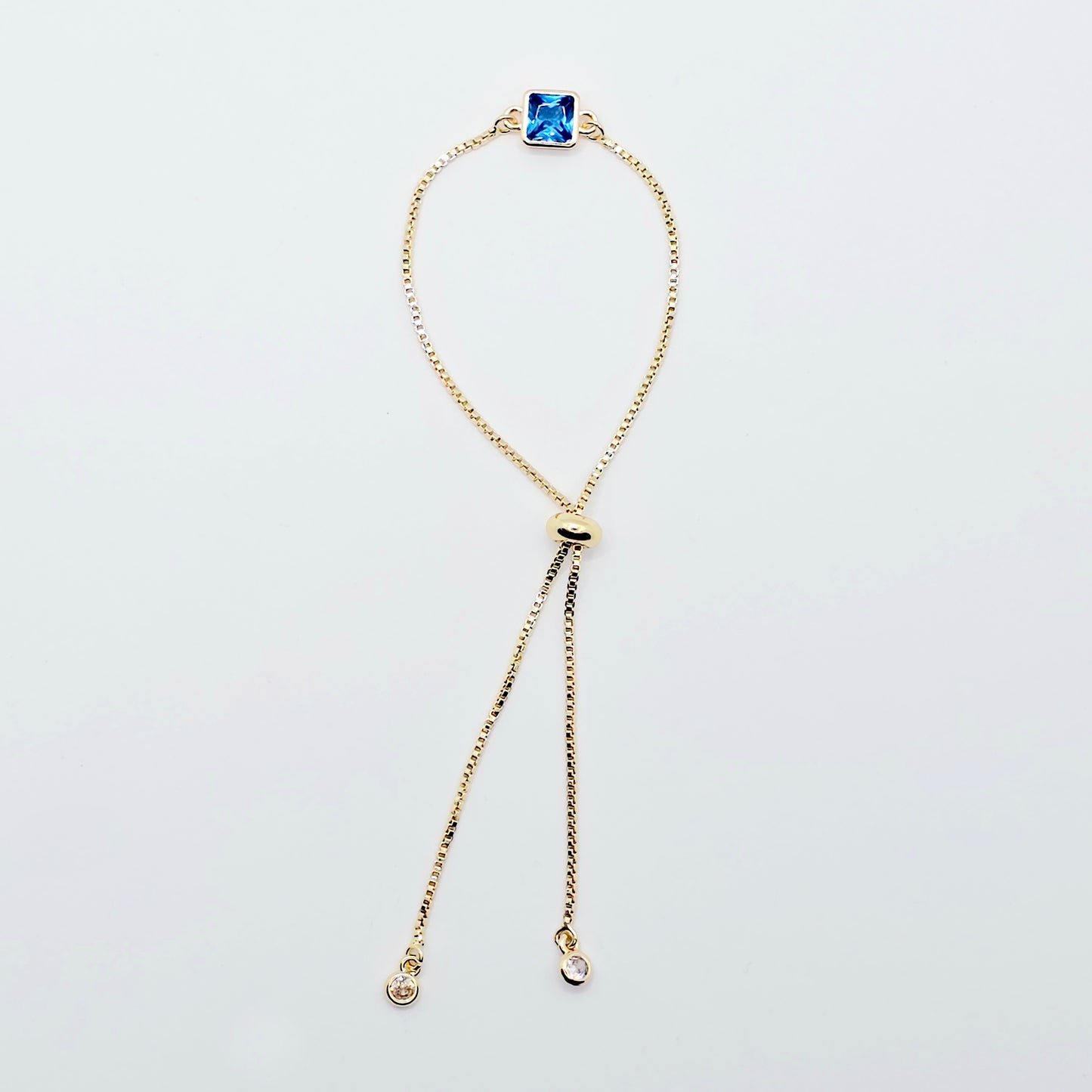 18k Gold Penis Noose Bracelet with Bright Blue Gem.