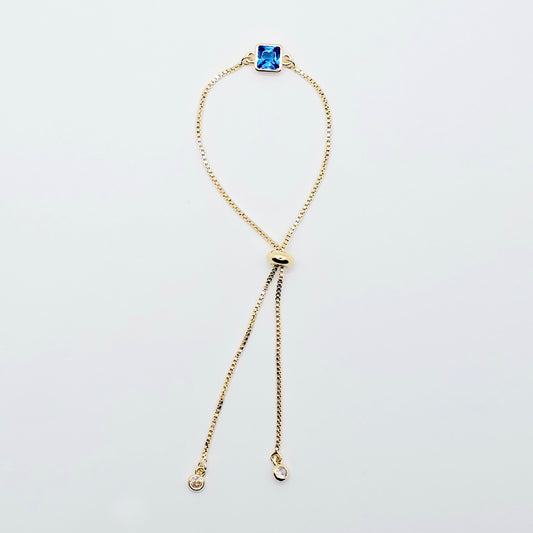 18k Gold Penis Noose Bracelet with Bright Blue Gem.