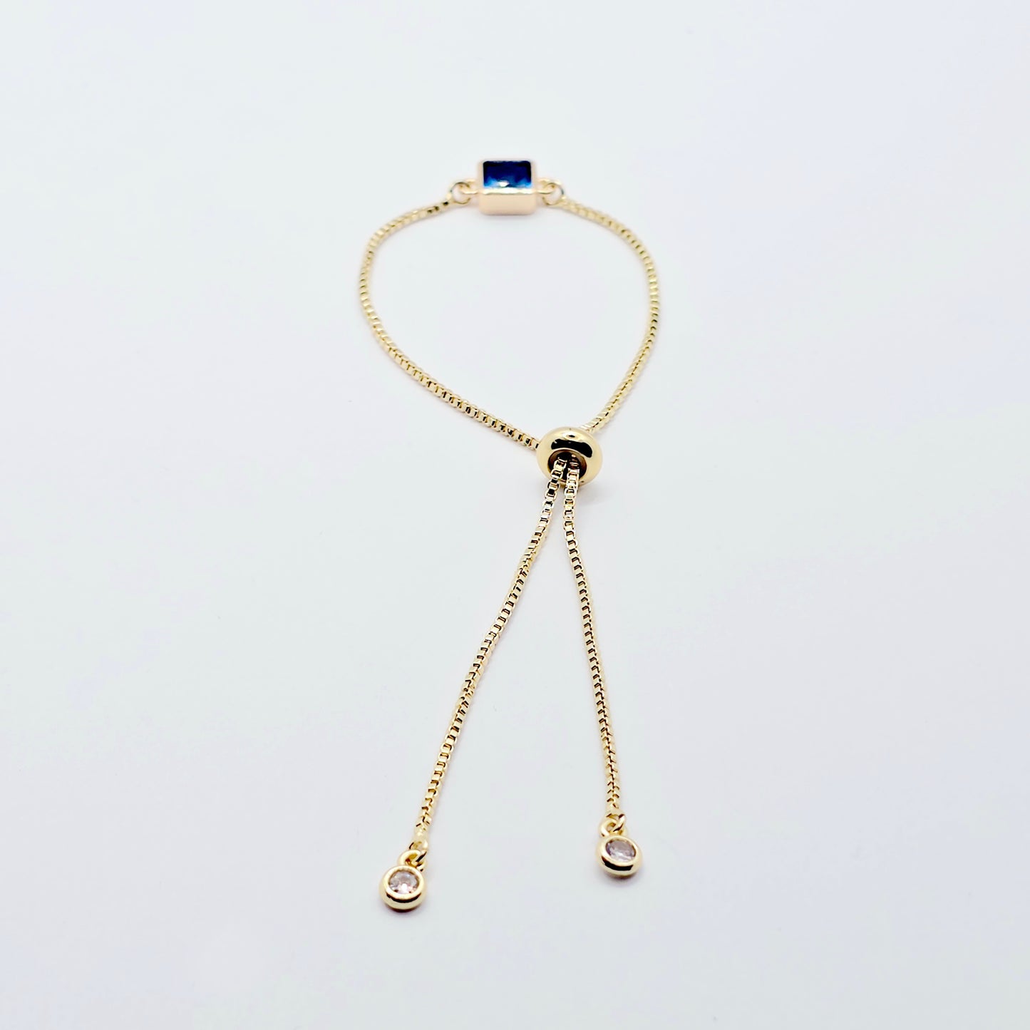 18k Gold Penis Noose Bracelet with Bright Blue Gem.