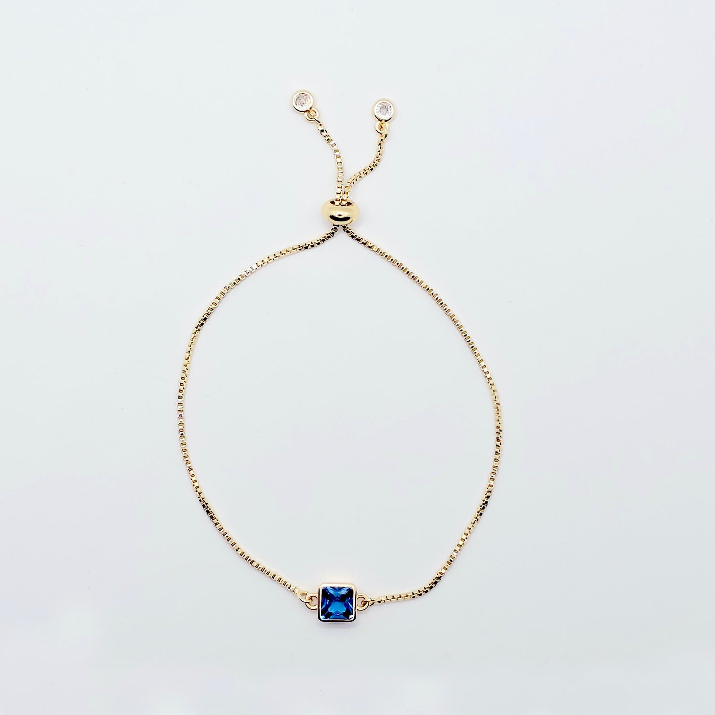18k Gold Penis Noose Bracelet with Bright Blue Gem.