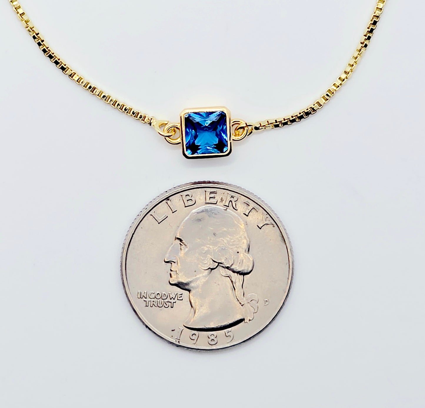 18k Gold Penis Noose Bracelet with Bright Blue Gem.