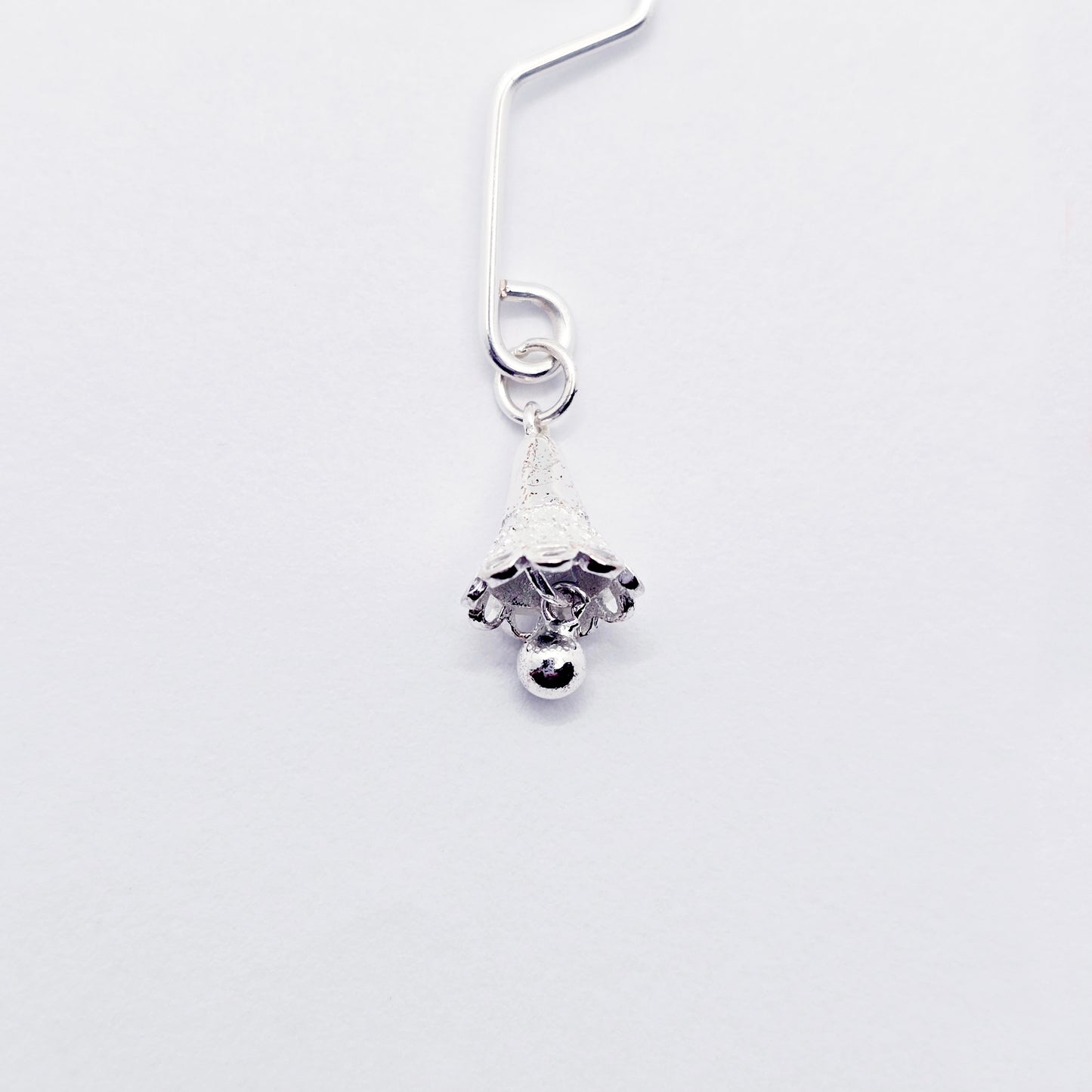 Labia Clip with Sterling Silver Bell Pendant.