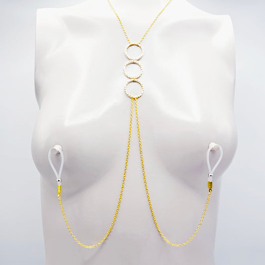 Gold Tri circle necklace attached to nipple nooses or feel the sting with one of our five types of nipple clamps.