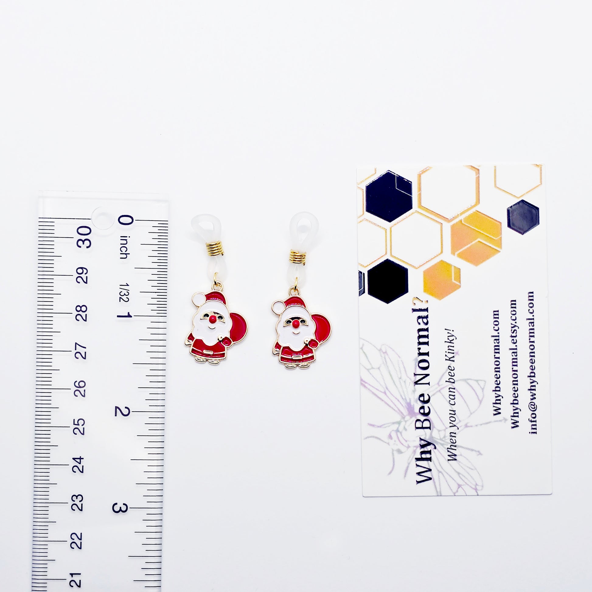 Santa Claus Nipple Nooses with a ruler for scale on a white background