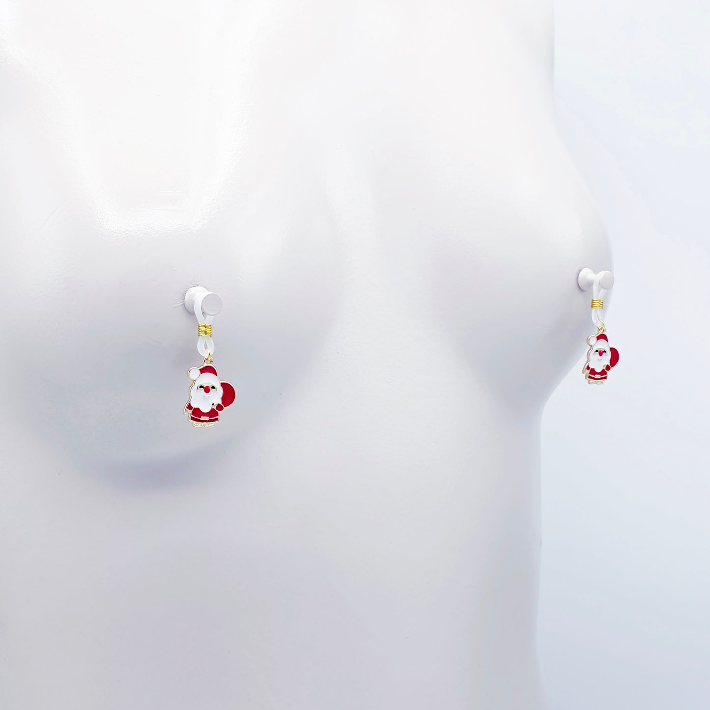 Pair of Santa Claus nipple nooses on a white background