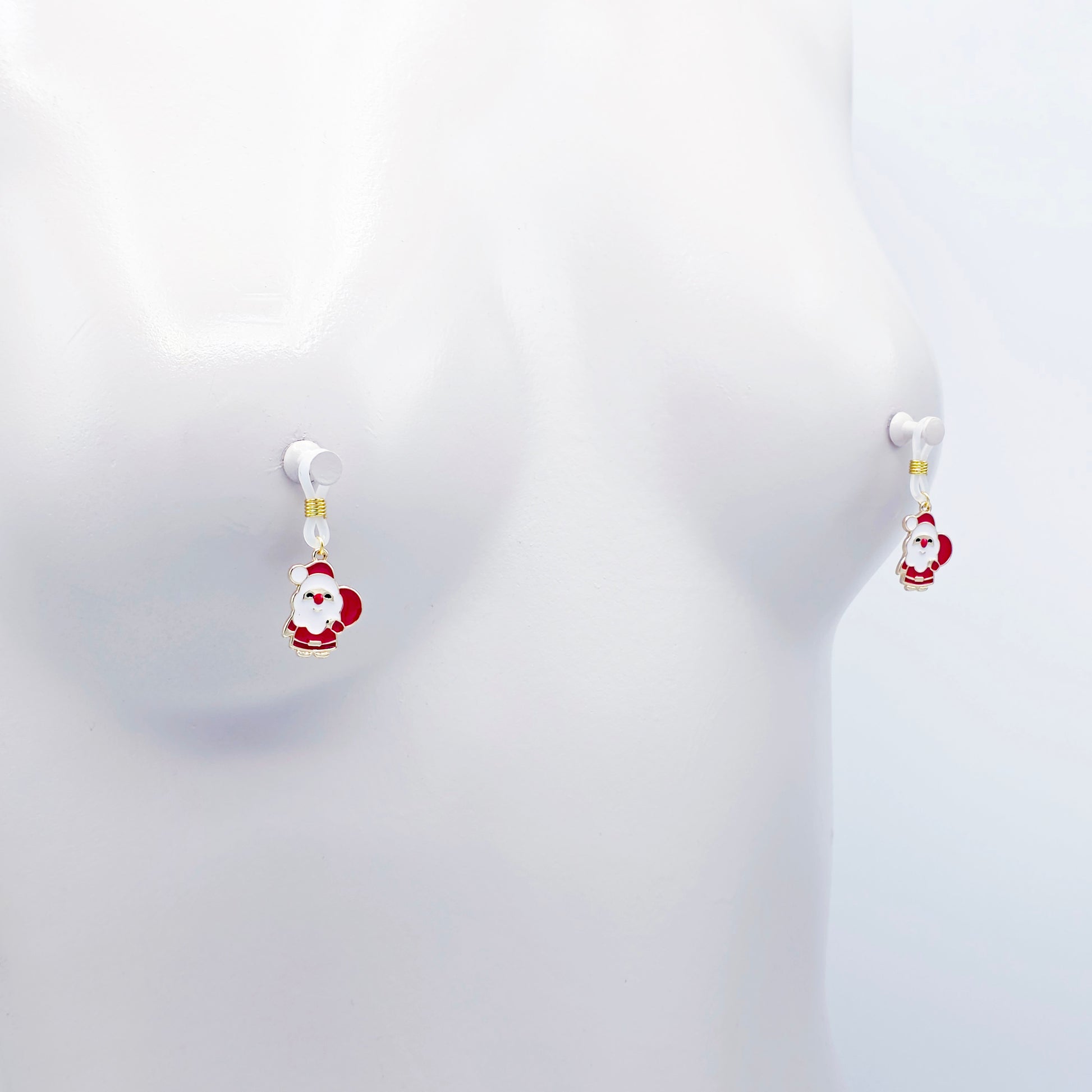 Pair of Santa Claus nipple nooses on a white background