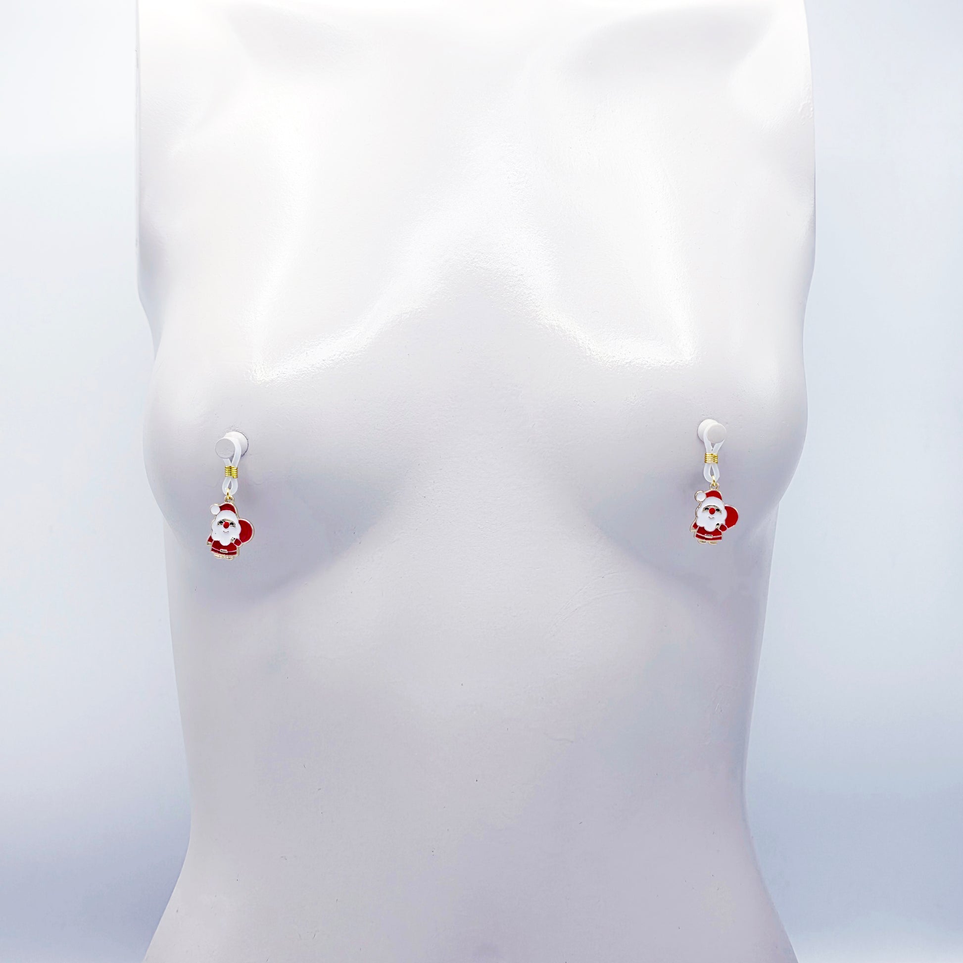 Pair of Santa Claus nipple nooses on a white background