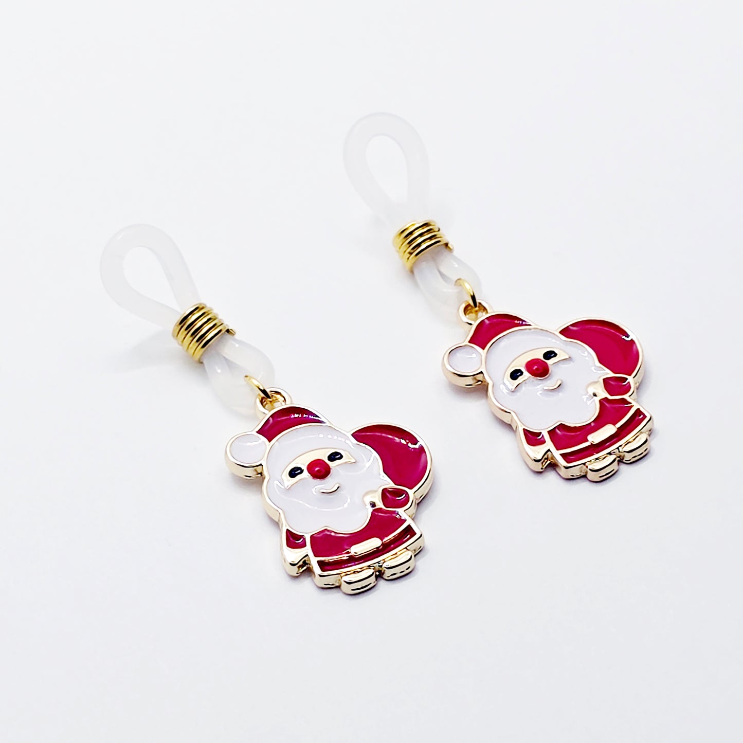 Pair of Santa Claus nipple nooses on a white background