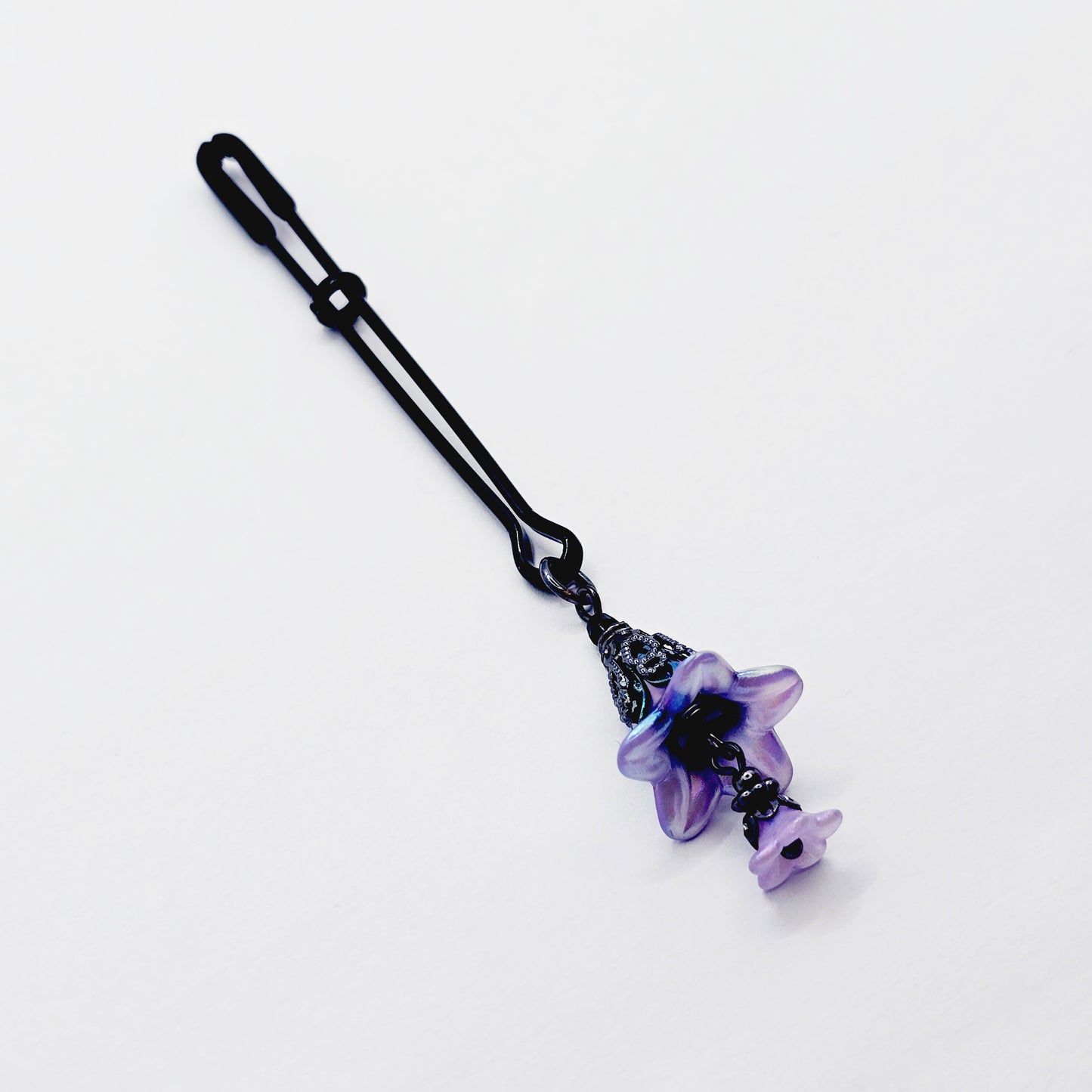 Floral Clitoral Clamp. Black Tweezer Clit Clamp with Purple Flower Dangle.