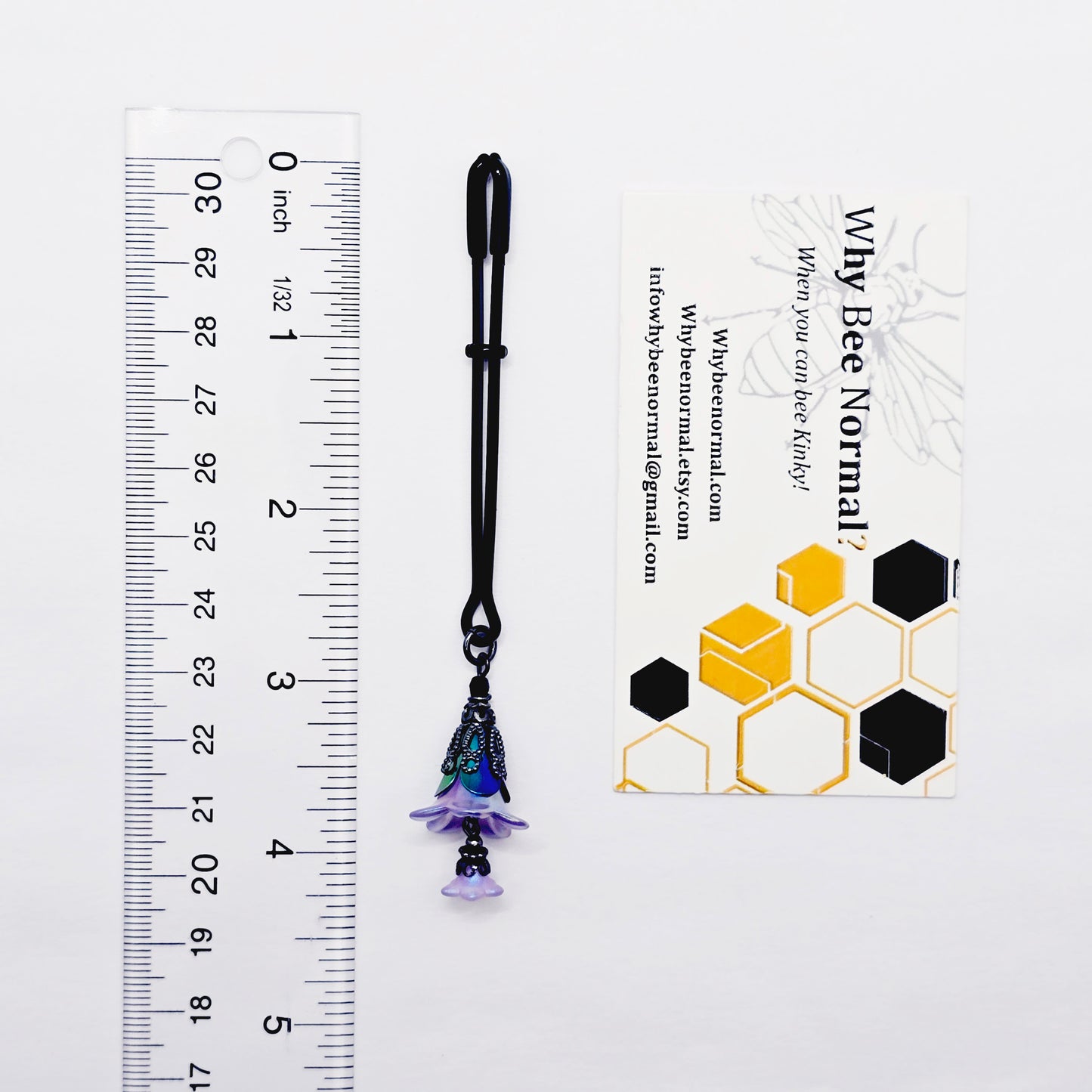 Floral Clitoral Clamp. Black Tweezer Clit Clamp with Purple Flower Dangle.