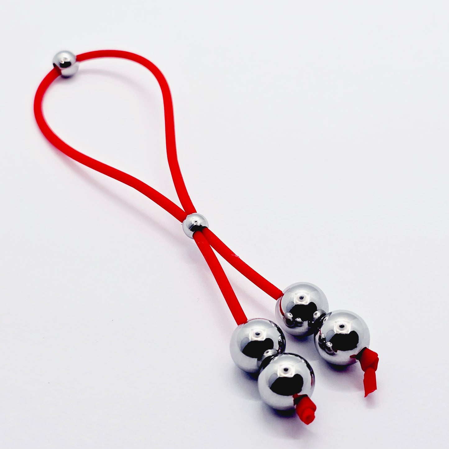 Weighted Penis Noose Jewelry in Red or Black Silicone, with Stainless Steel Bead Weights.