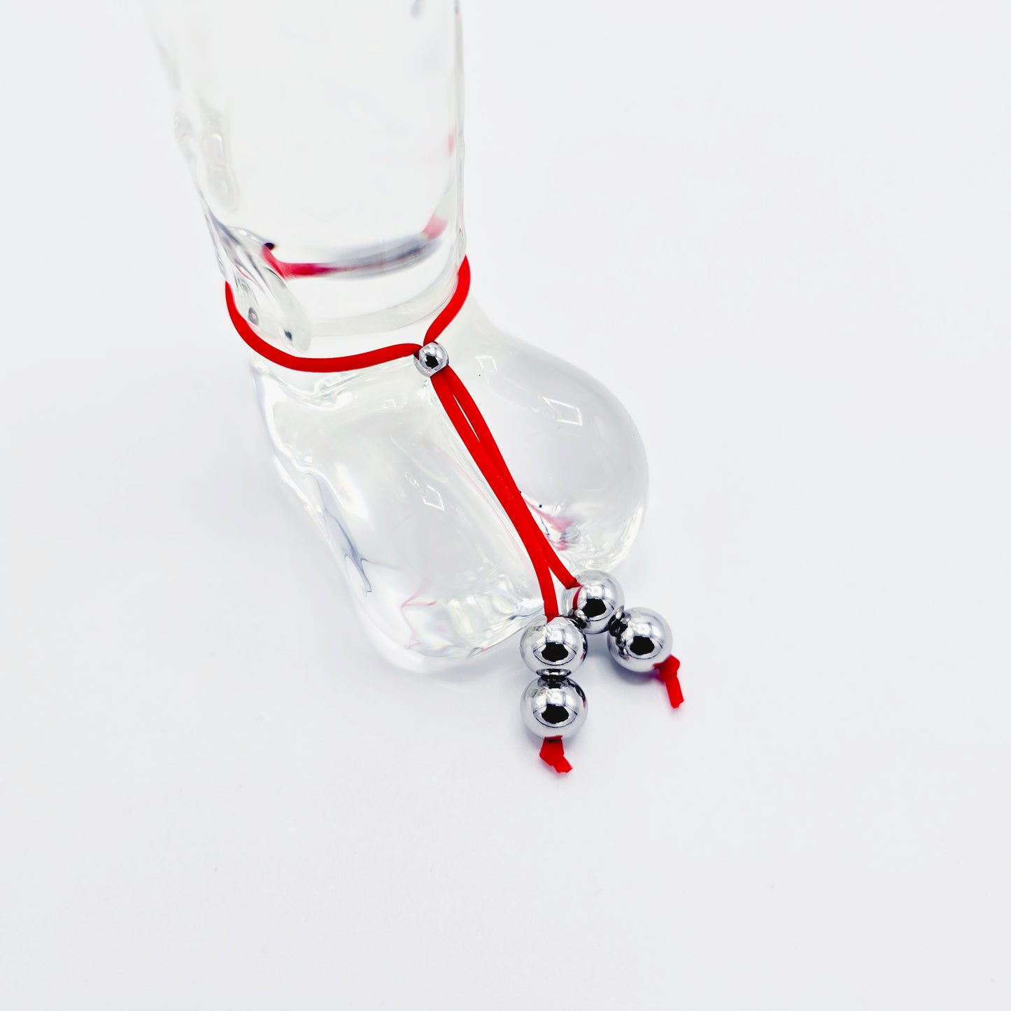 Weighted Penis Noose Jewelry in Red or Black Silicone, with Stainless Steel Bead Weights.