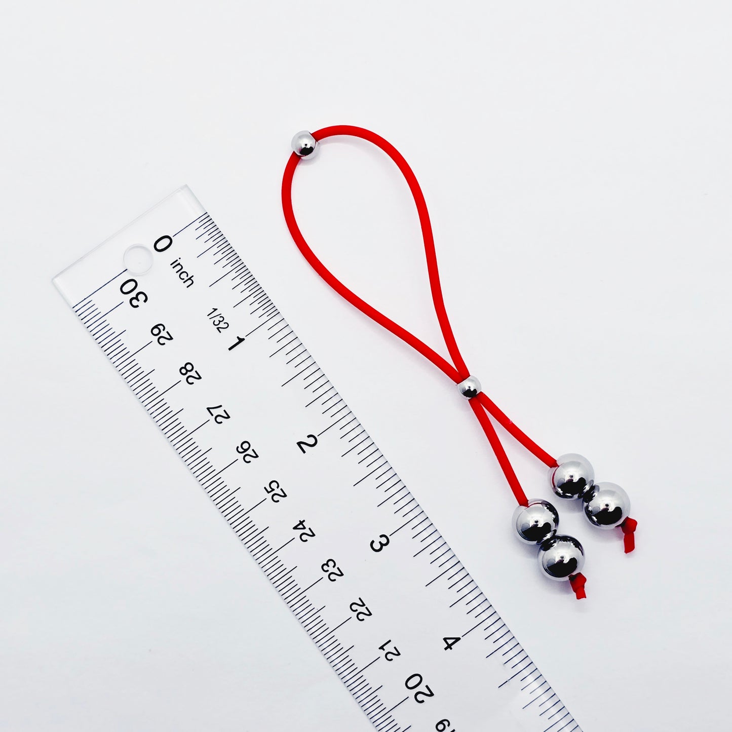 Weighted Penis Noose Jewelry in Red or Black Silicone, with Stainless Steel Bead Weights.