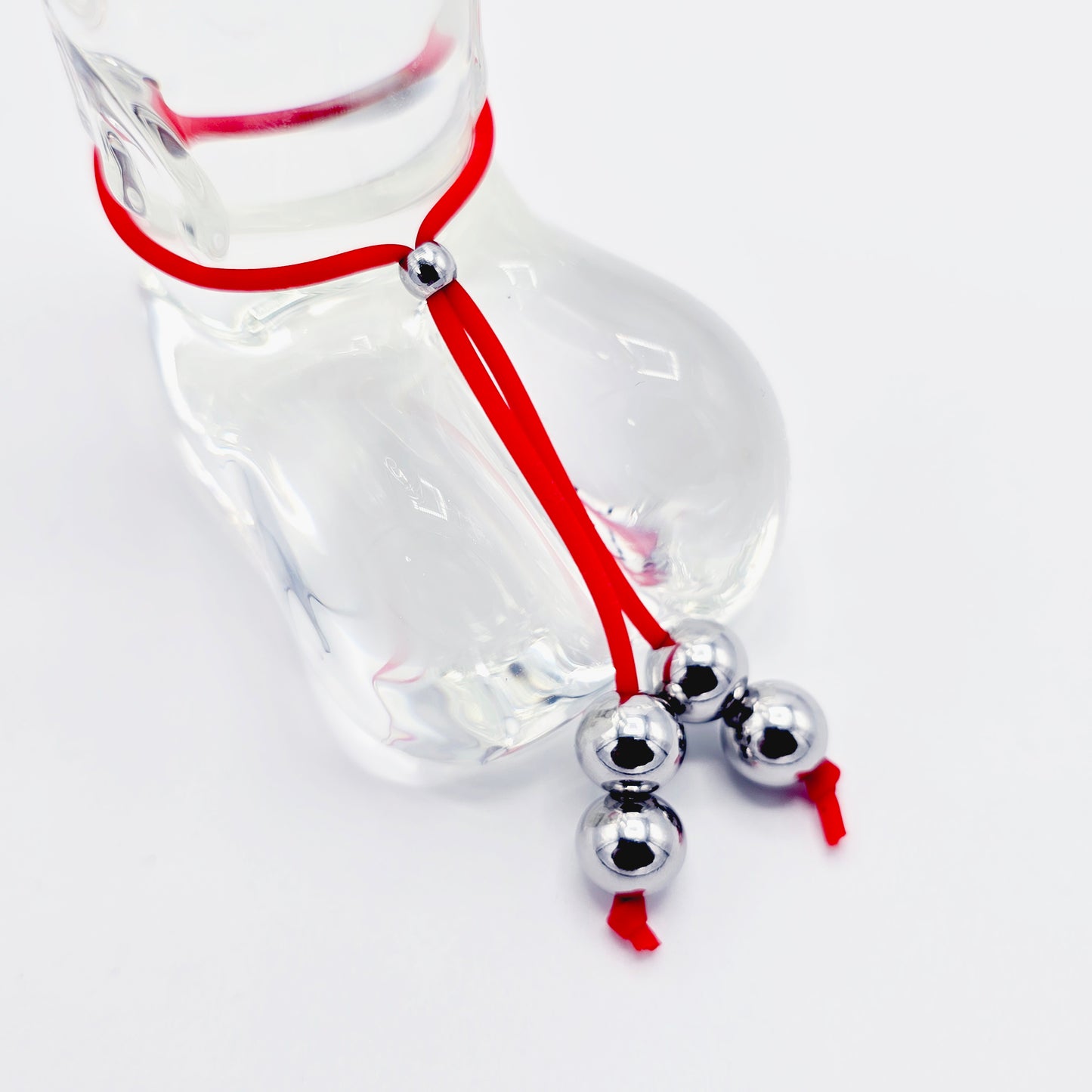 Weighted Penis Noose Jewelry in Red or Black Silicone, with Stainless Steel Bead Weights.