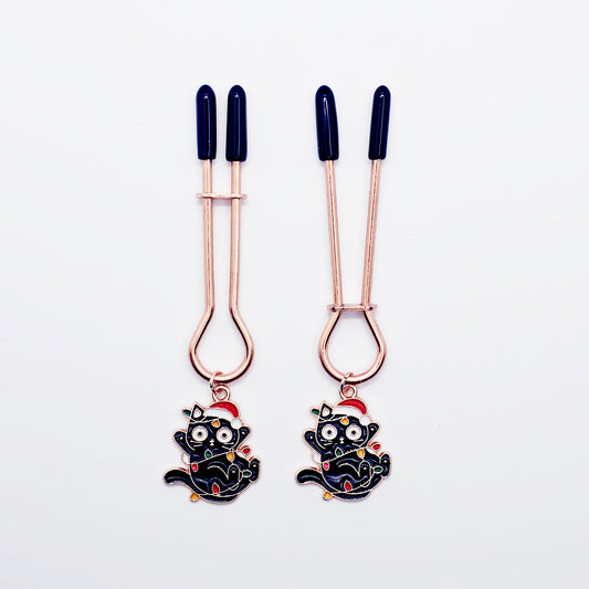 Holiday Nipple Clamps. Rose Gold Straight Tweezer Clamps with Naughty Christmas Kittens.