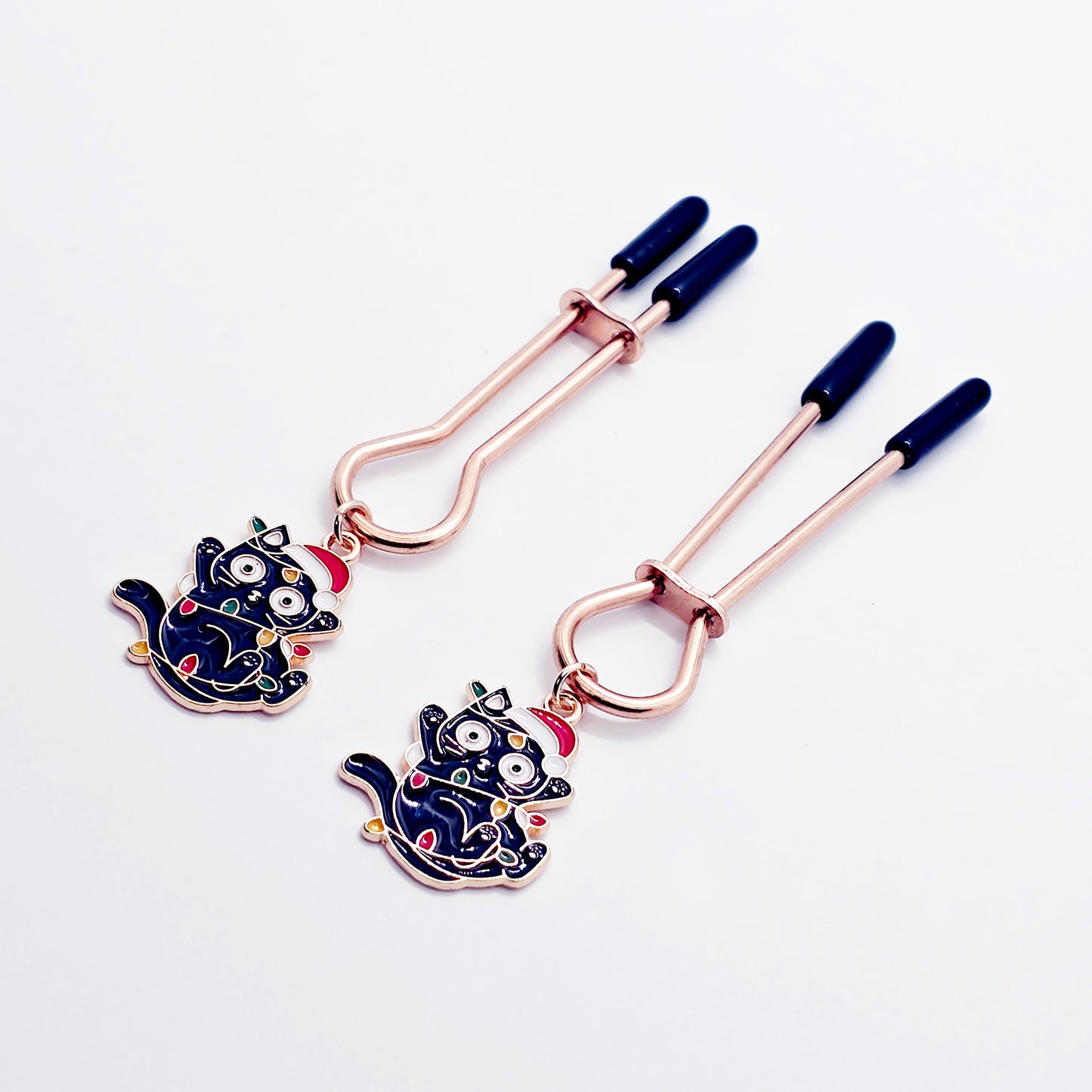 Holiday Nipple Clamps. Rose Gold Straight Tweezer Clamps with Naughty Christmas Kittens.