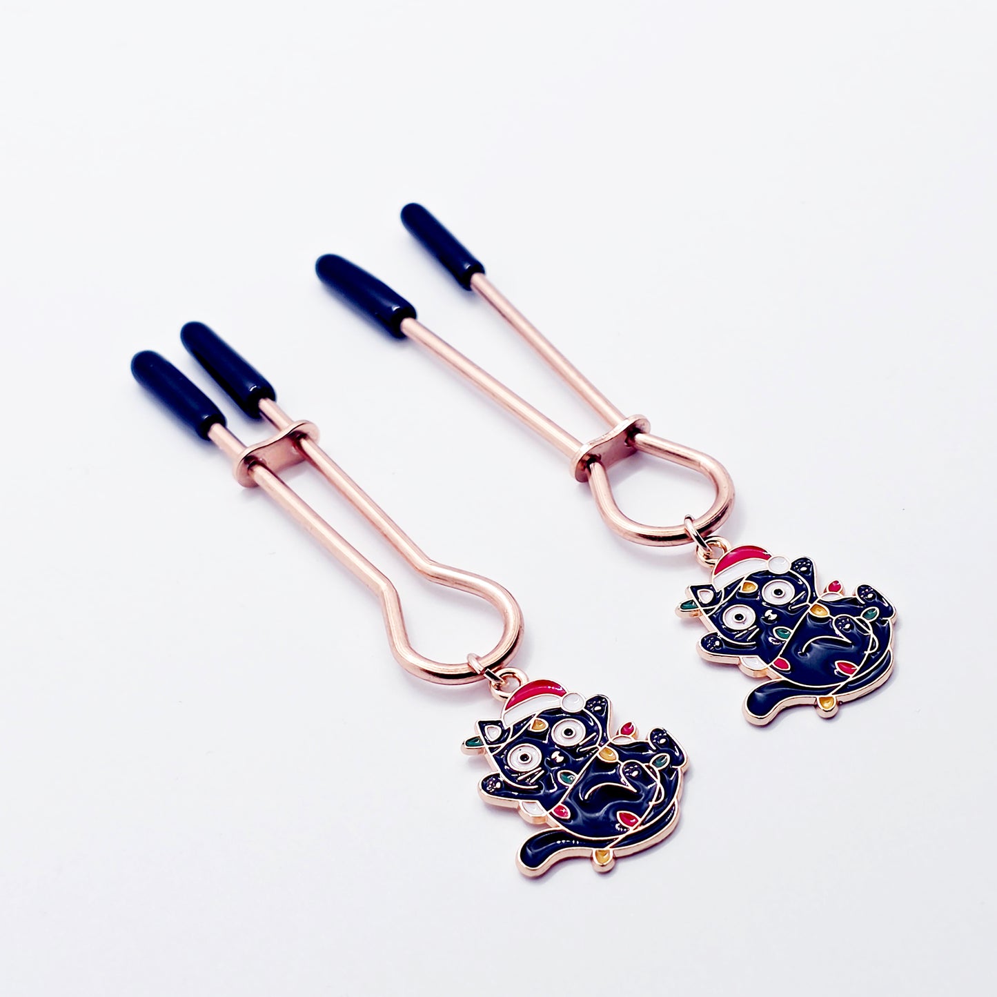 Holiday Nipple Clamps. Rose Gold Straight Tweezer Clamps with Naughty Christmas Kittens.