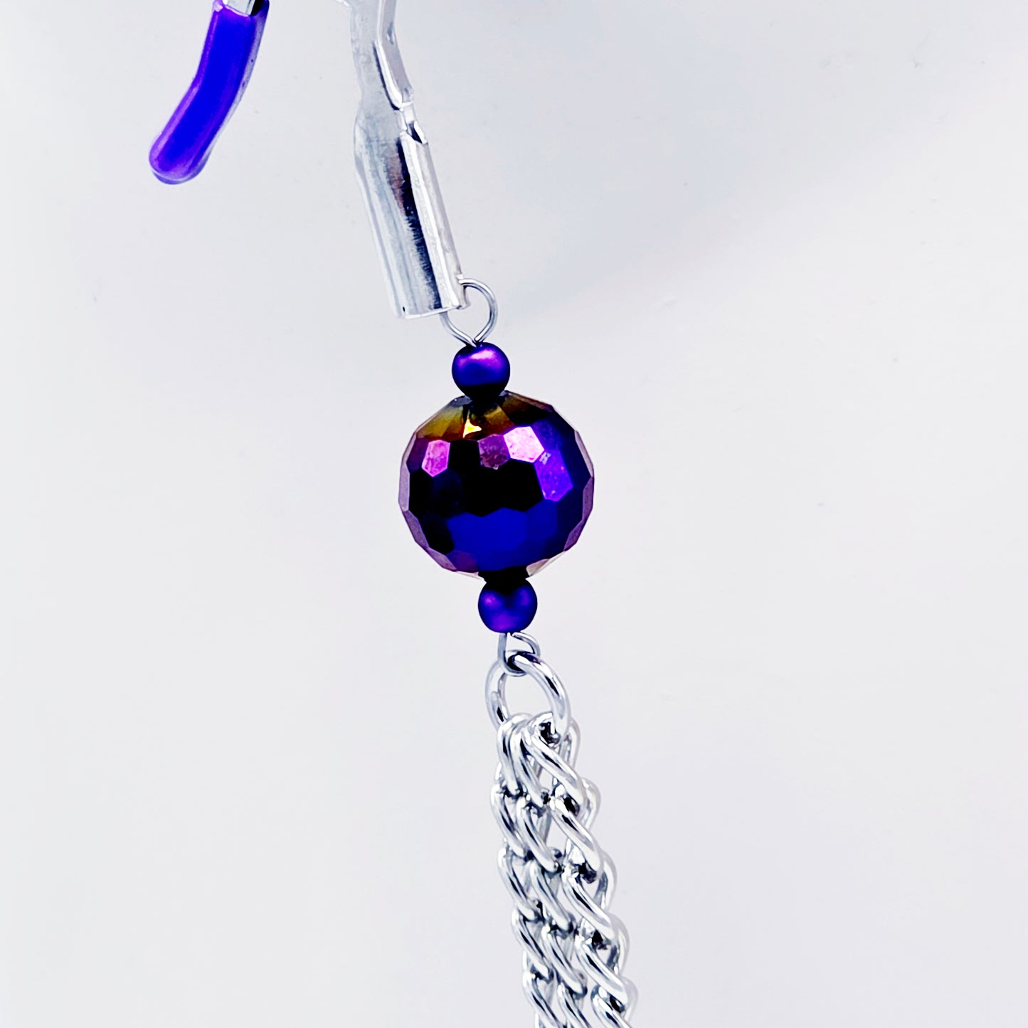 Adjustable Clamps, Purple, with Multiple Chains Attached.