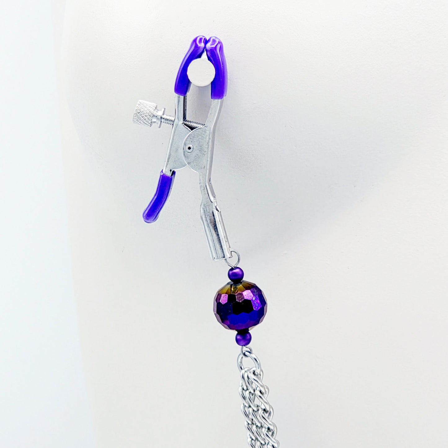 Adjustable Clamps, Purple, with Multiple Chains Attached.