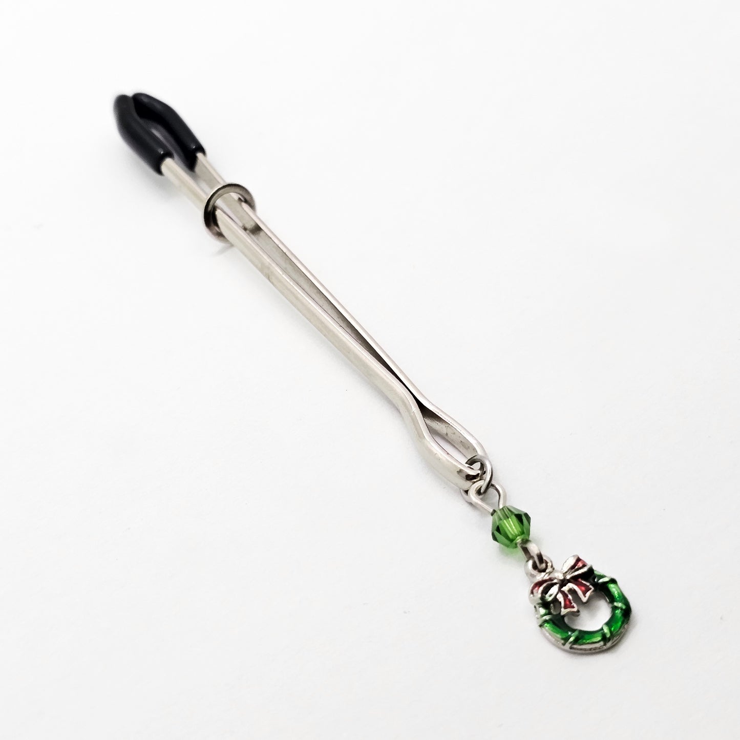 Holiday Clit Clamp Featuring Wreath and Green Chrystal. Tweezer Clitoral Clamp for Enhanced Stimulation.