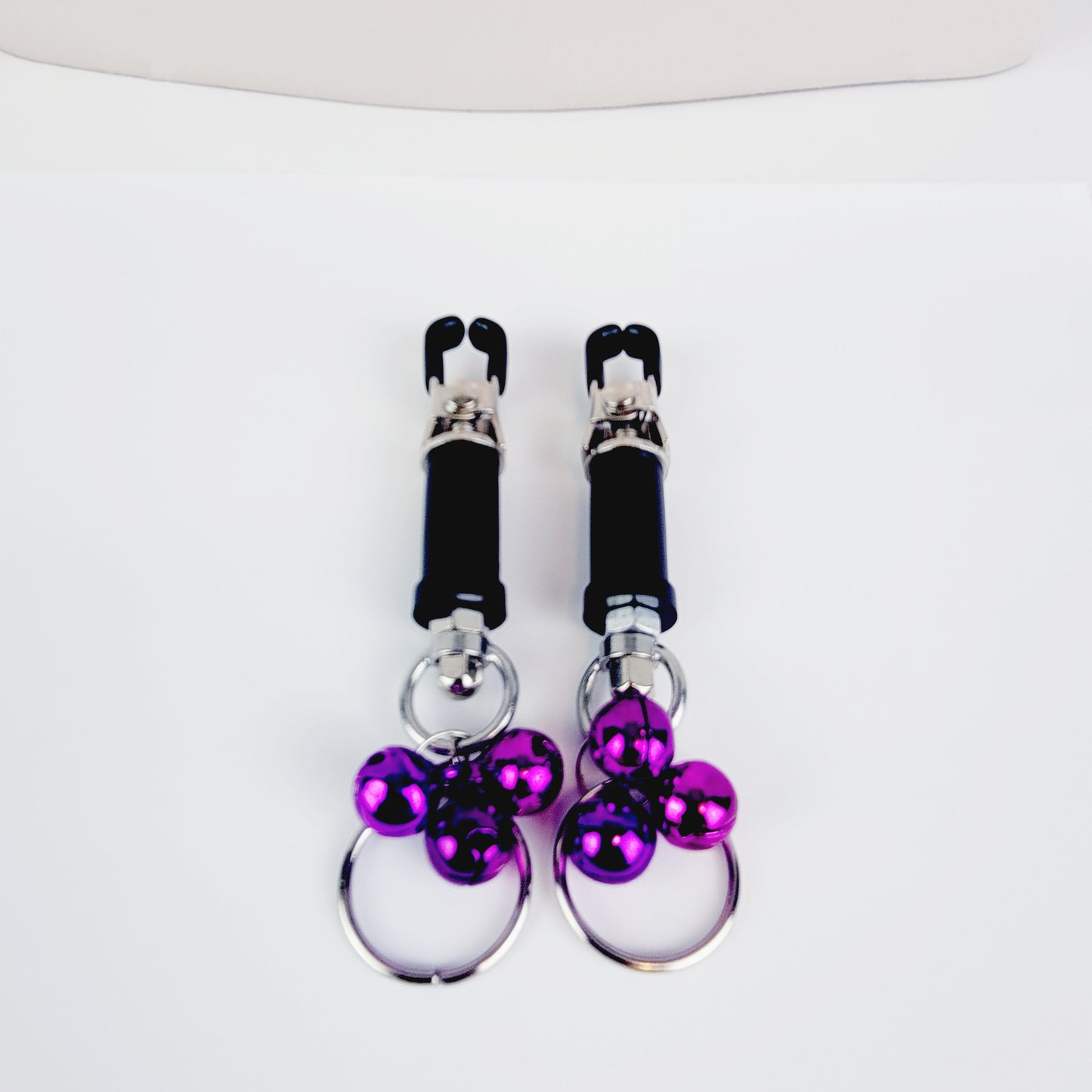 BDSM Nipple Clamps. Barrel Nipple Clamps with Bells and Pull Rings. MATURE