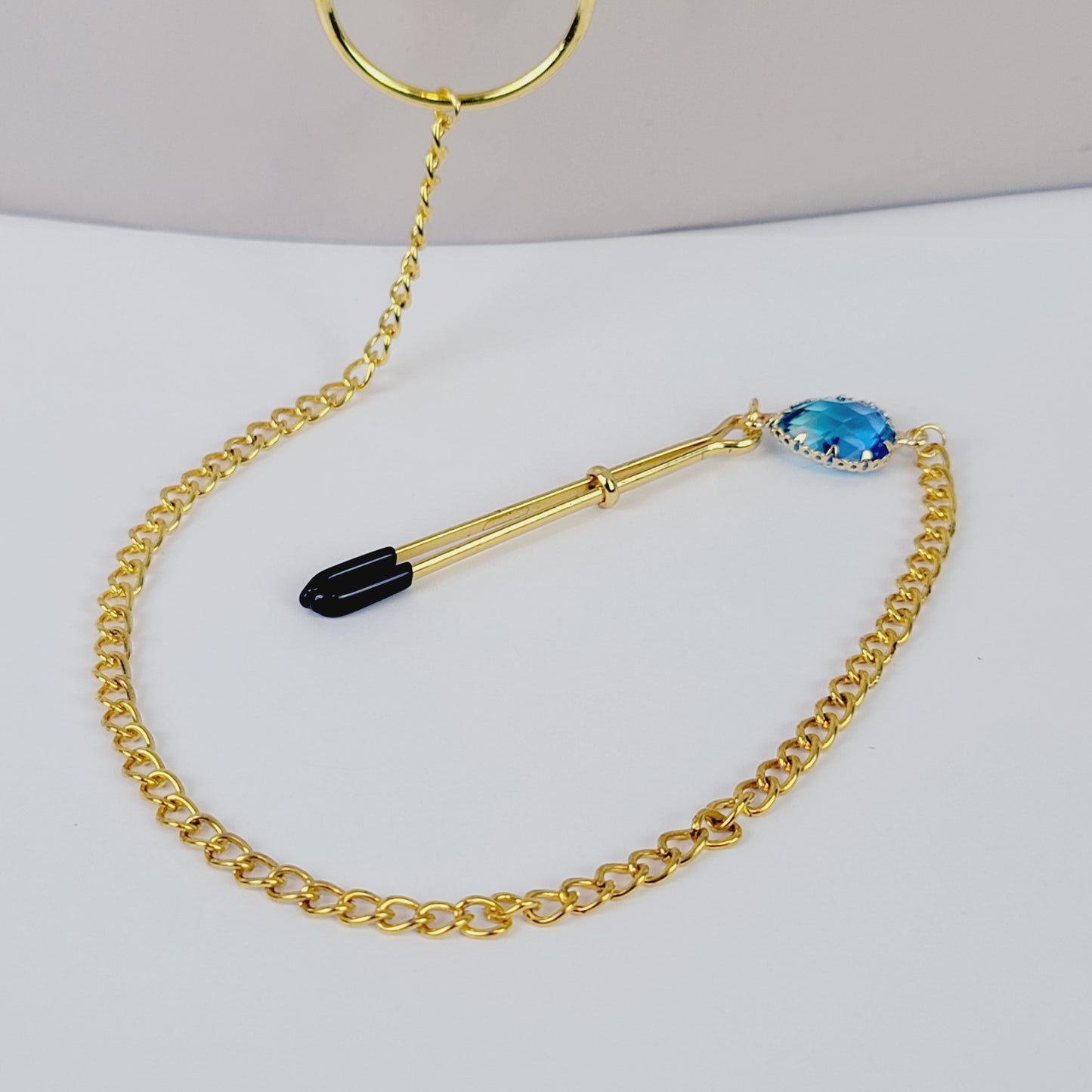 Nipple To Clit Clamps. Gold Tweezer Nipple Clamps, Chain Attached, with Tweezer Clitoral Clamp and Blue Gems. MATURE, BDSM