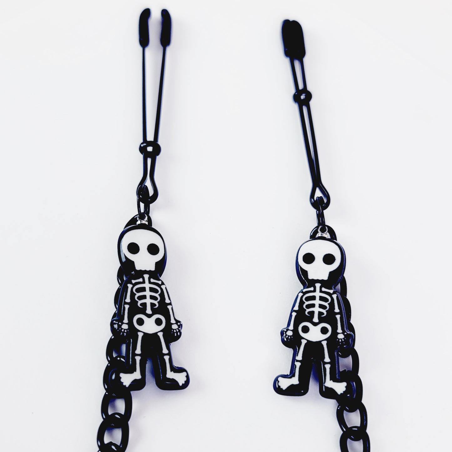 Nipple Clamps with Skeletons. Black Tweezer Clamps attached with Black Chain. Adult Toy for Nipple Play. Halloween, BDSM, MATURE